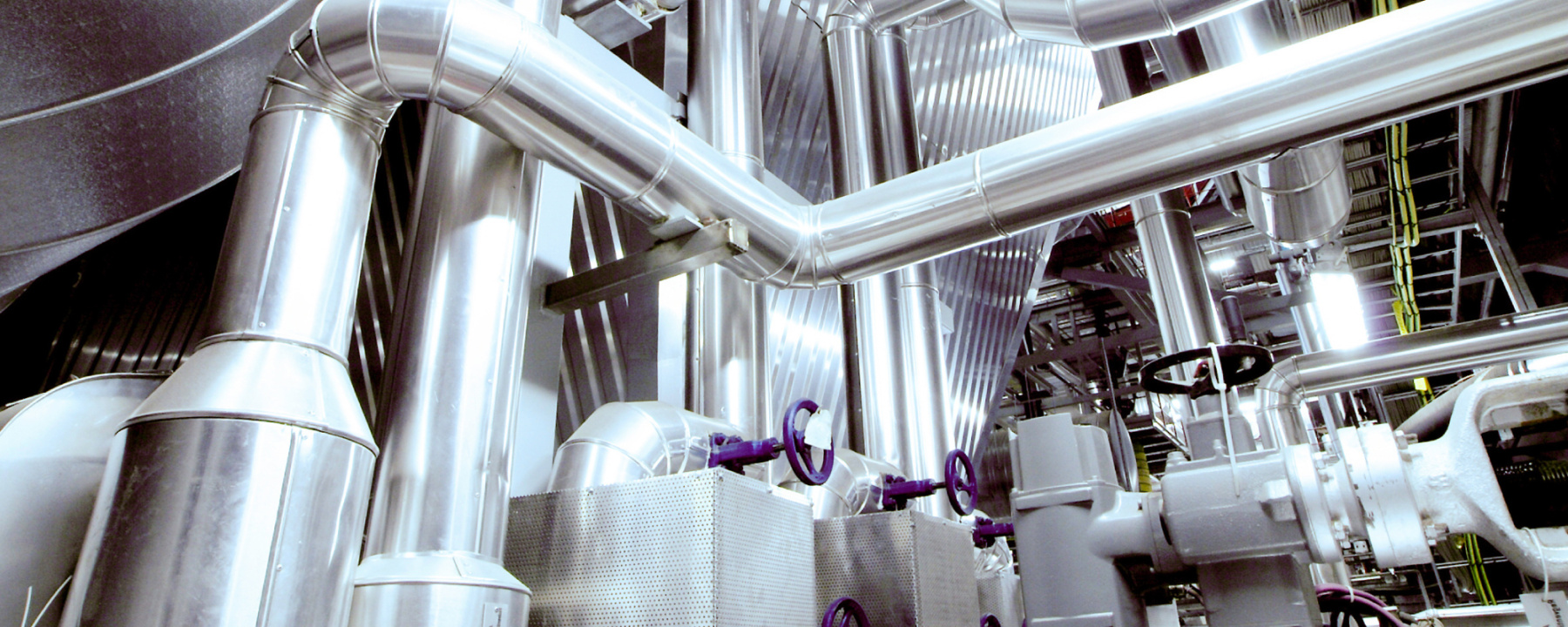 Cables and piping found inside a modern industrial power plant