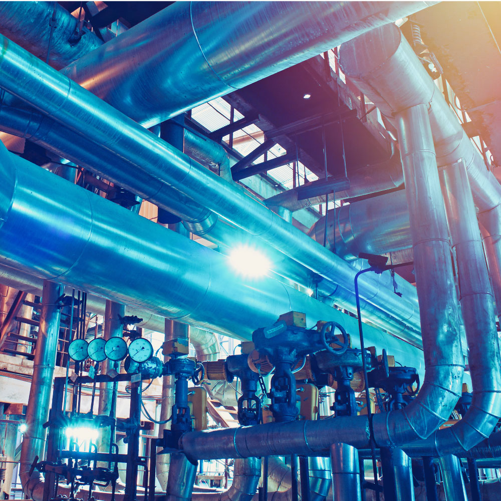 Equipment, cables and piping as found inside of a modern industrial power plant