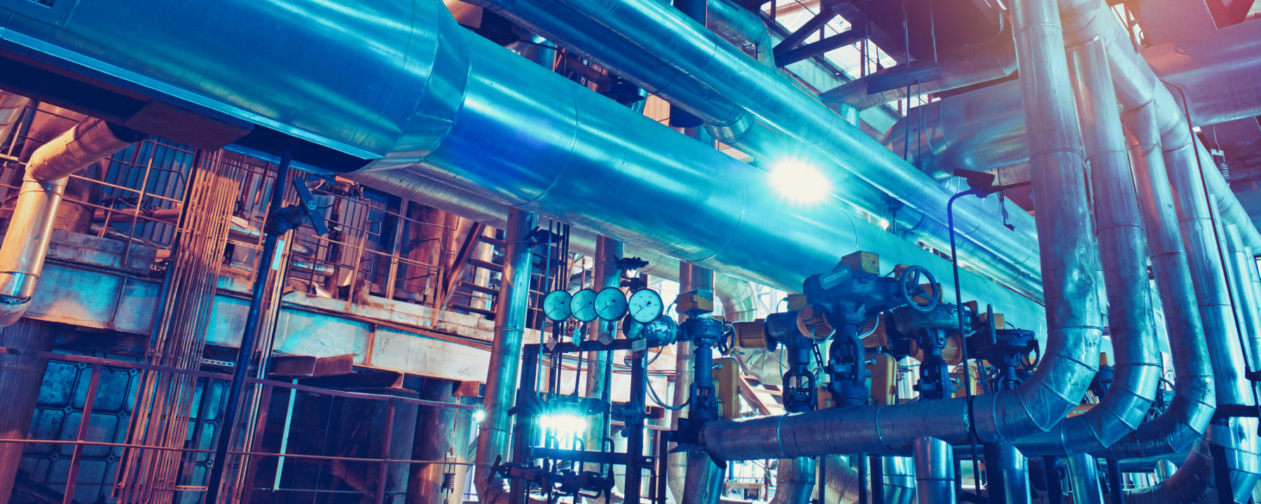 Equipment, cables and piping as found inside of a modern industrial power plant