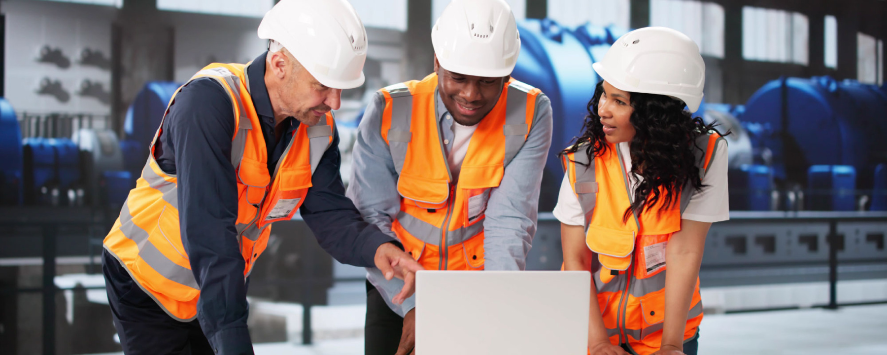 Engineers looking at a laptop - Power Plant